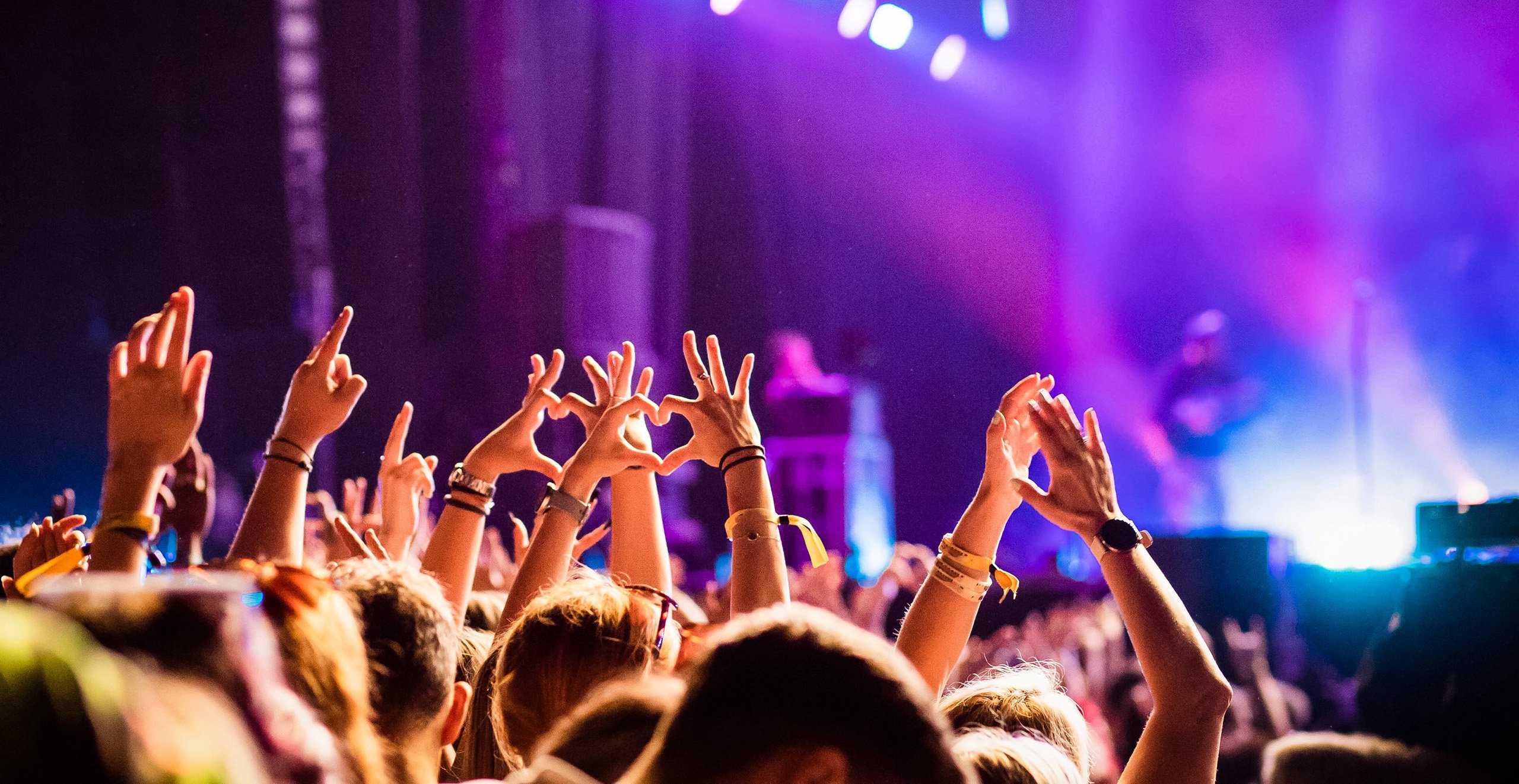 excited-crowd-enjoying-a-concert-with-raised-hands-2026-03-24-15-36-29-utc-2